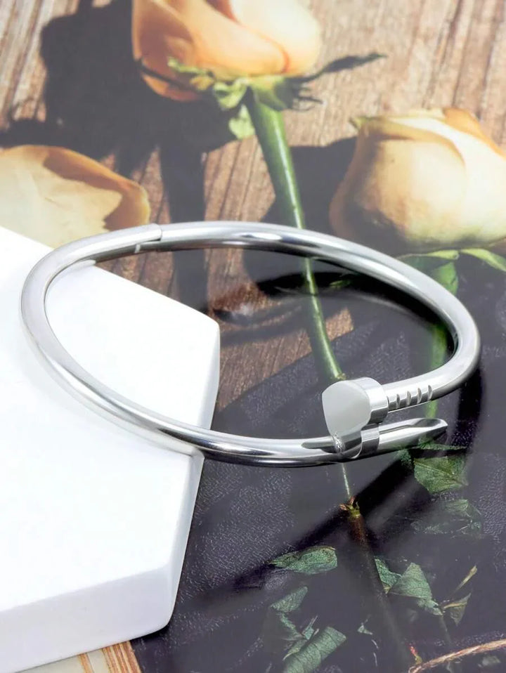 Gleaming Gold Tone Stainless Steel Four Leaf Clover Bangle
