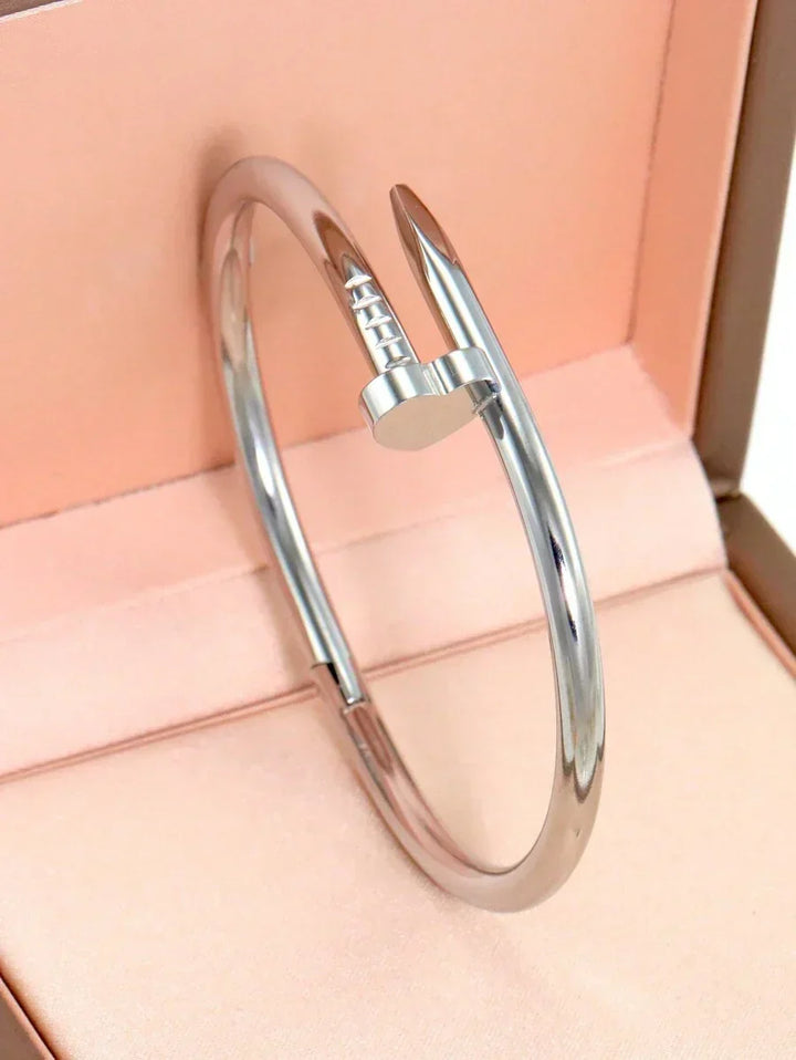 Gleaming Gold Tone Stainless Steel Four Leaf Clover Bangle