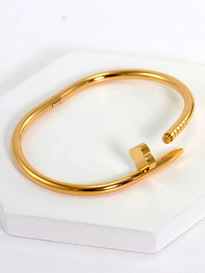 Gleaming Gold Tone Stainless Steel Four Leaf Clover Bangle
